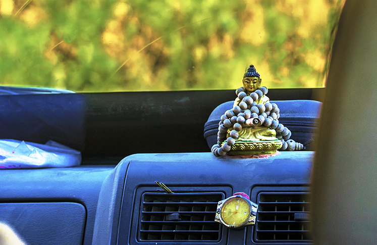 Buddha on the dashboard